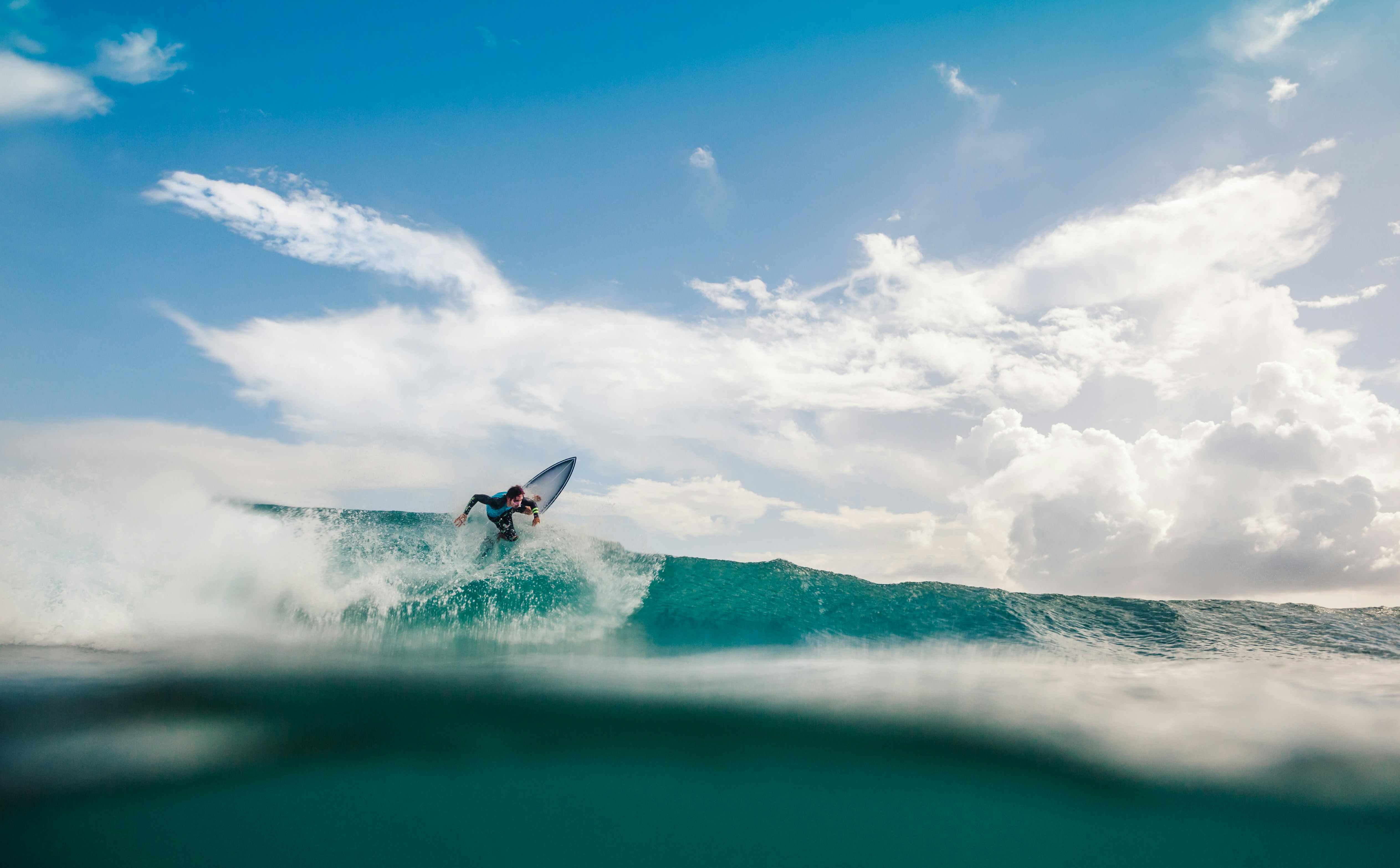 man surfing the waves on ocean